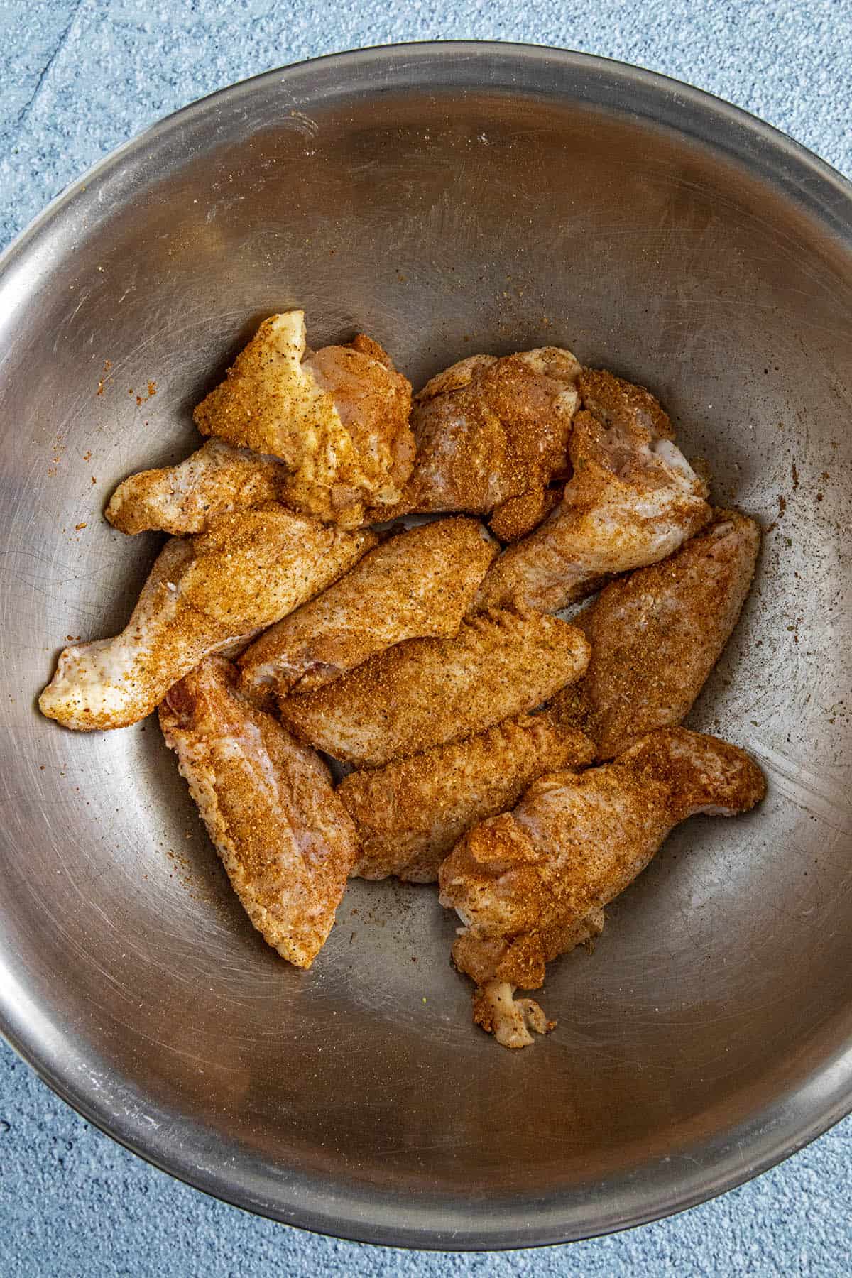 Seasoning the chicken wings