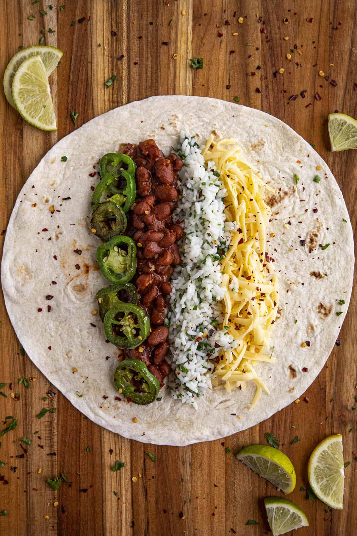 Bean burrito filled with beans, cilaintro-lime rice, cheese and jalapenos, ready to fold.