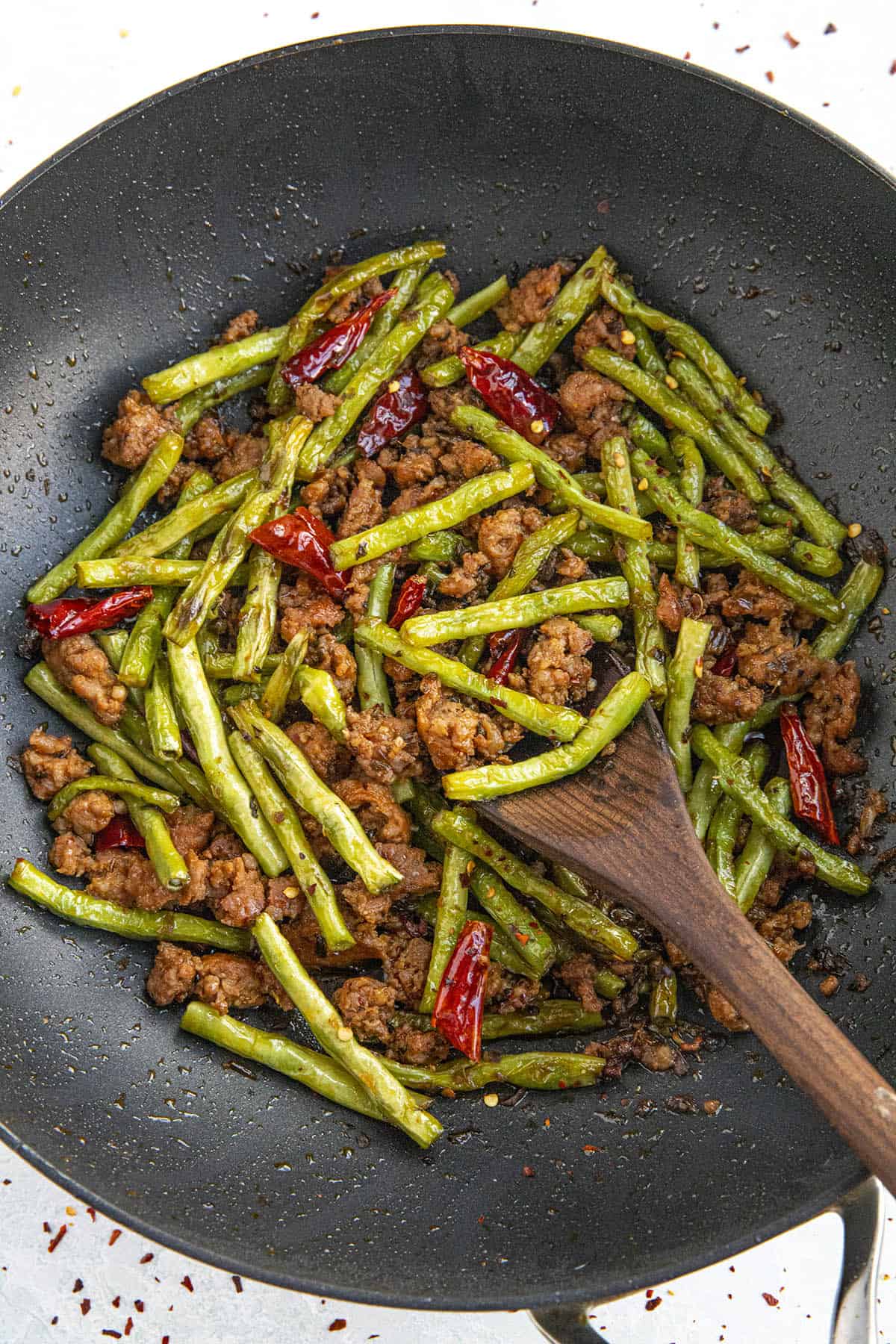 spicy Sichuan Dry Fried Green Beans in a pan, ready for the table