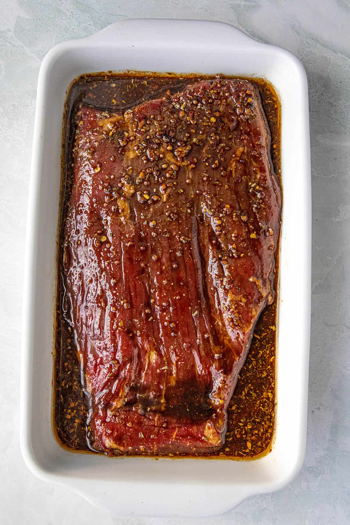 Marinating flank steak in a wide dish