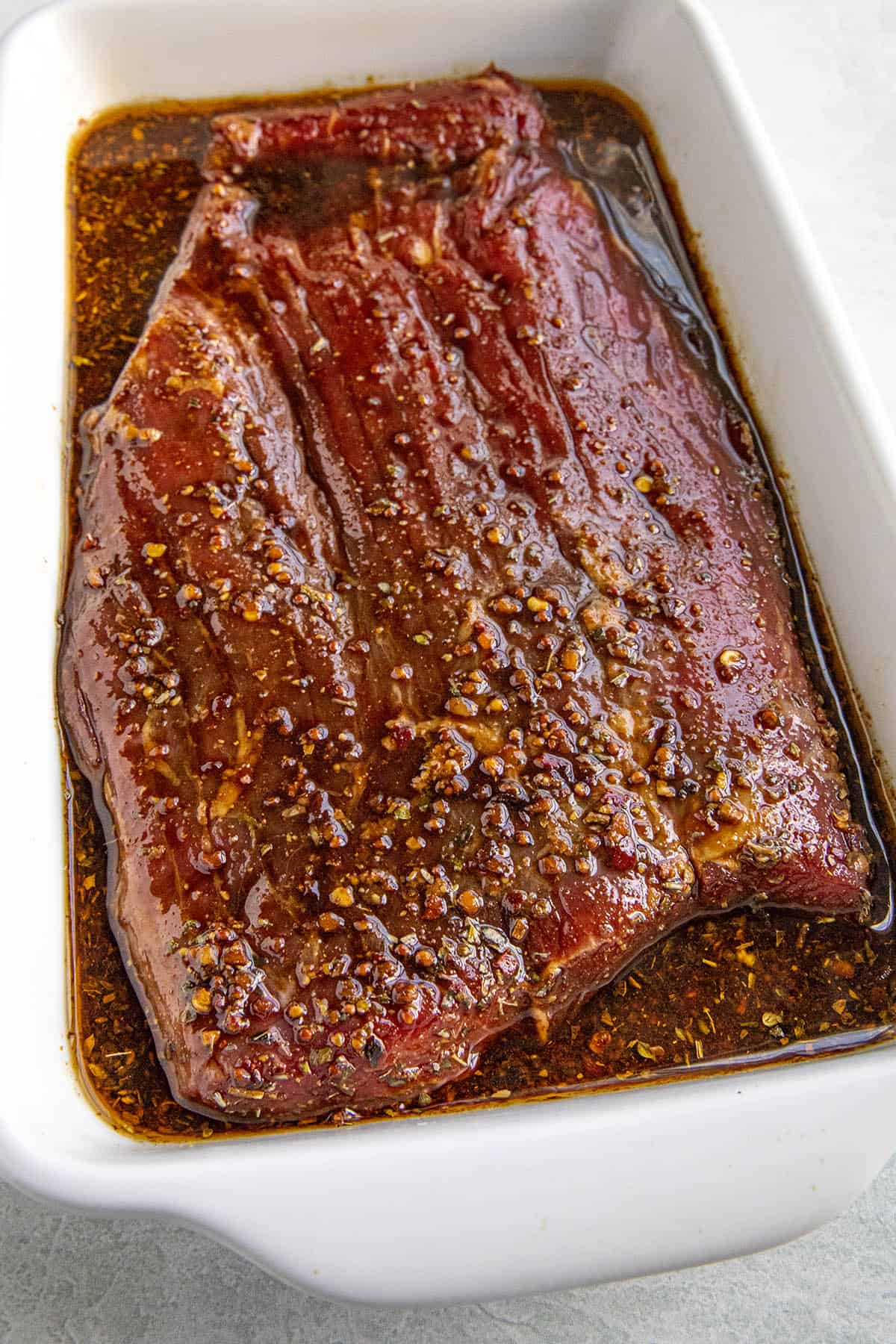 Marinating flank steak in a dish