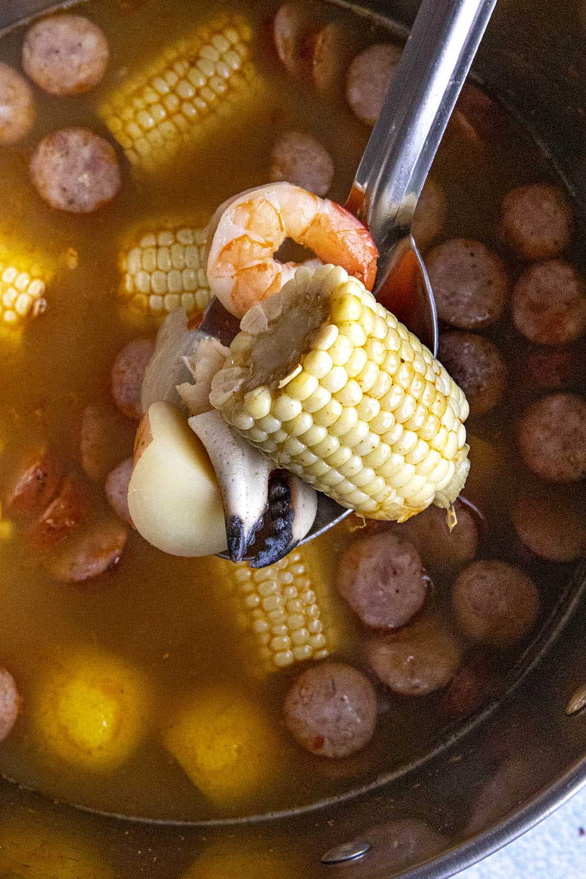 A big scoop of seafood, corn and andouille from my pot of low country boil