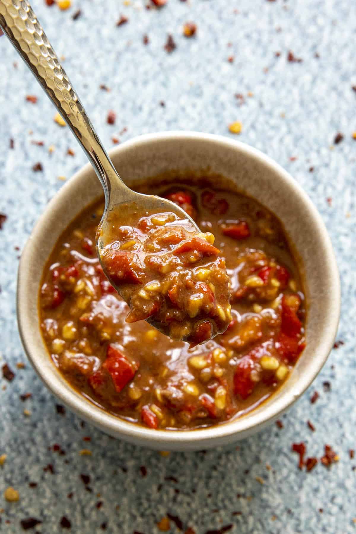 Fiery Sambal terasi in a mortar in a small bowl