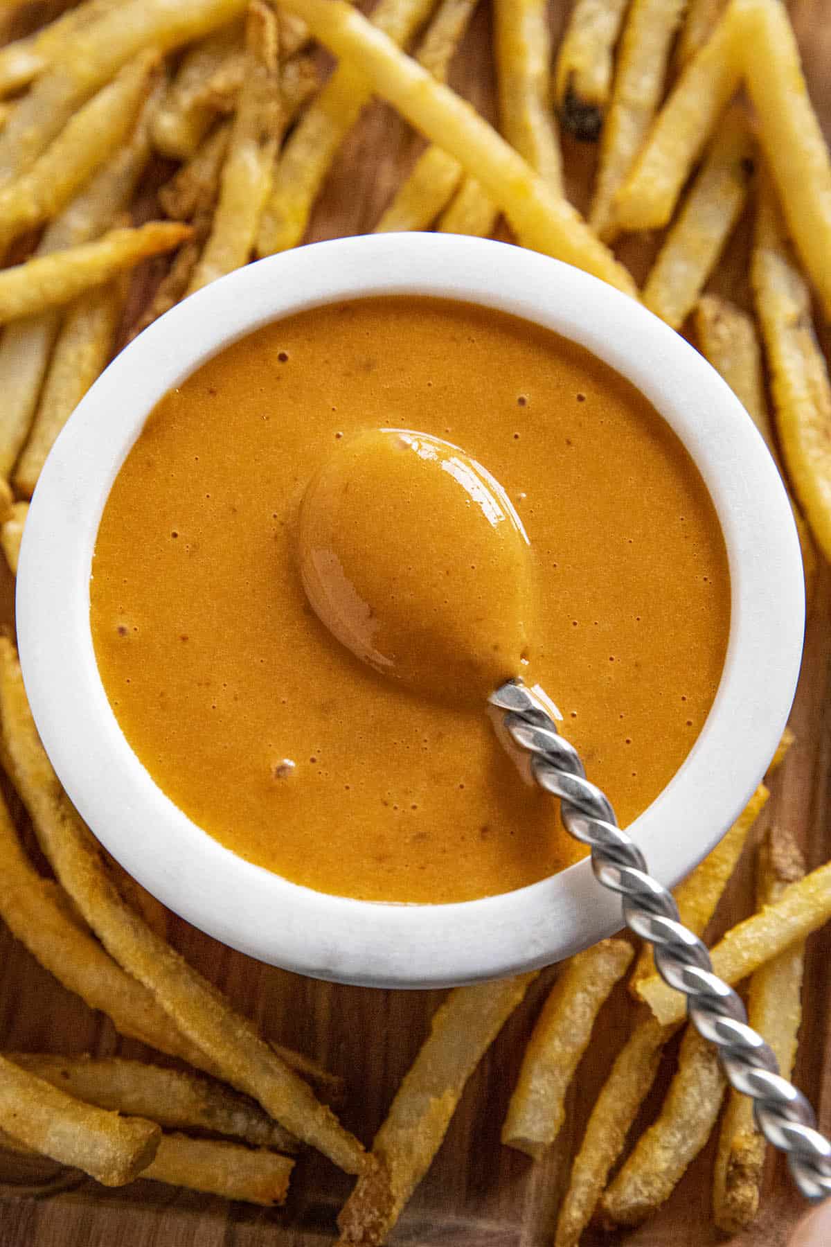 Chipotle Aioli in a bowl surrounded by french fries