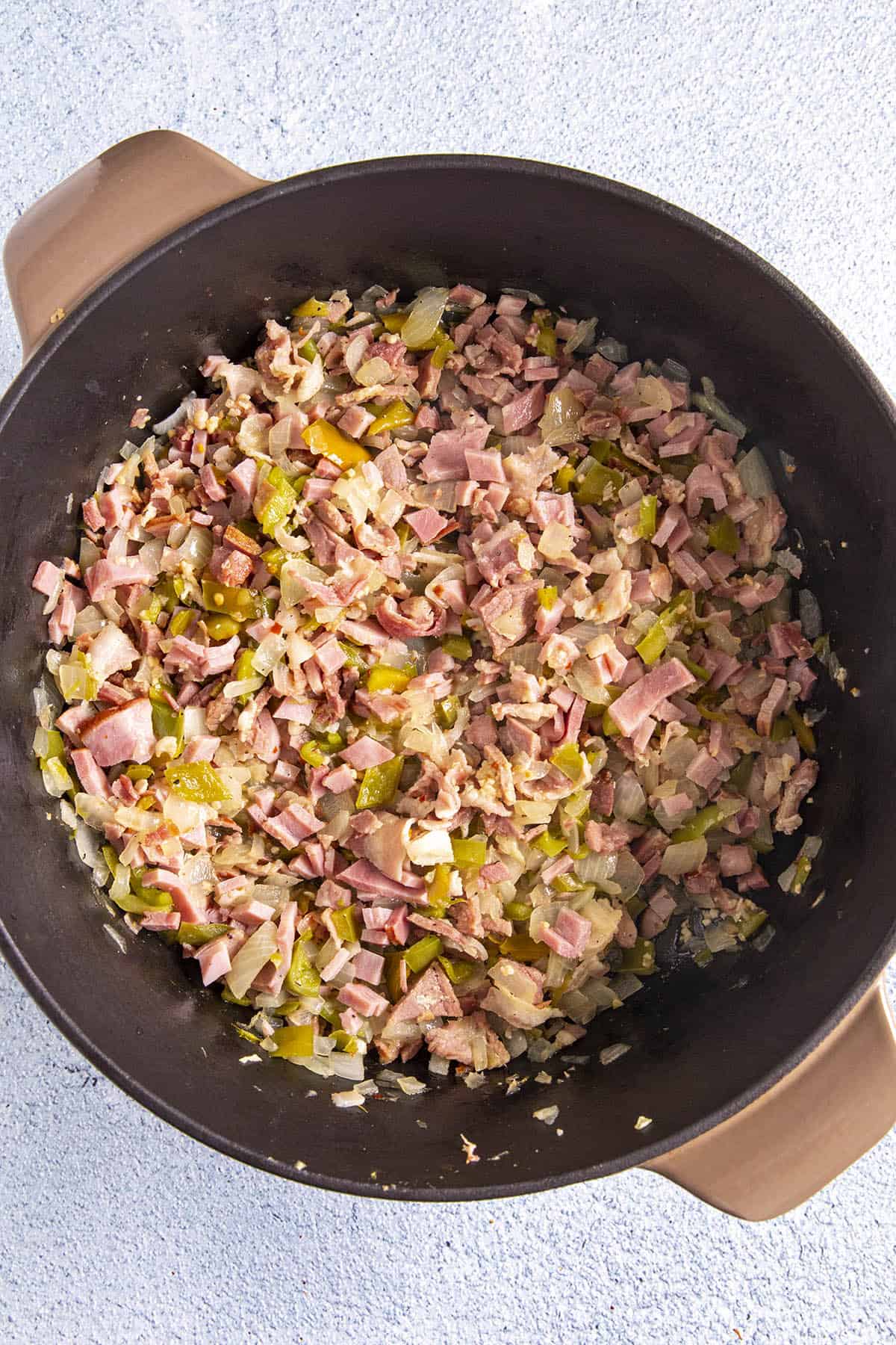 Cooking ham and vegetables in a pot