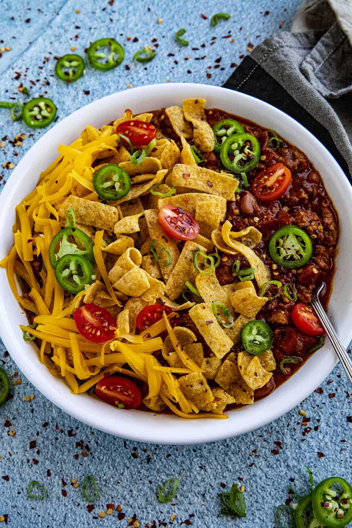 Frito Pie in a bowl with extra peppers