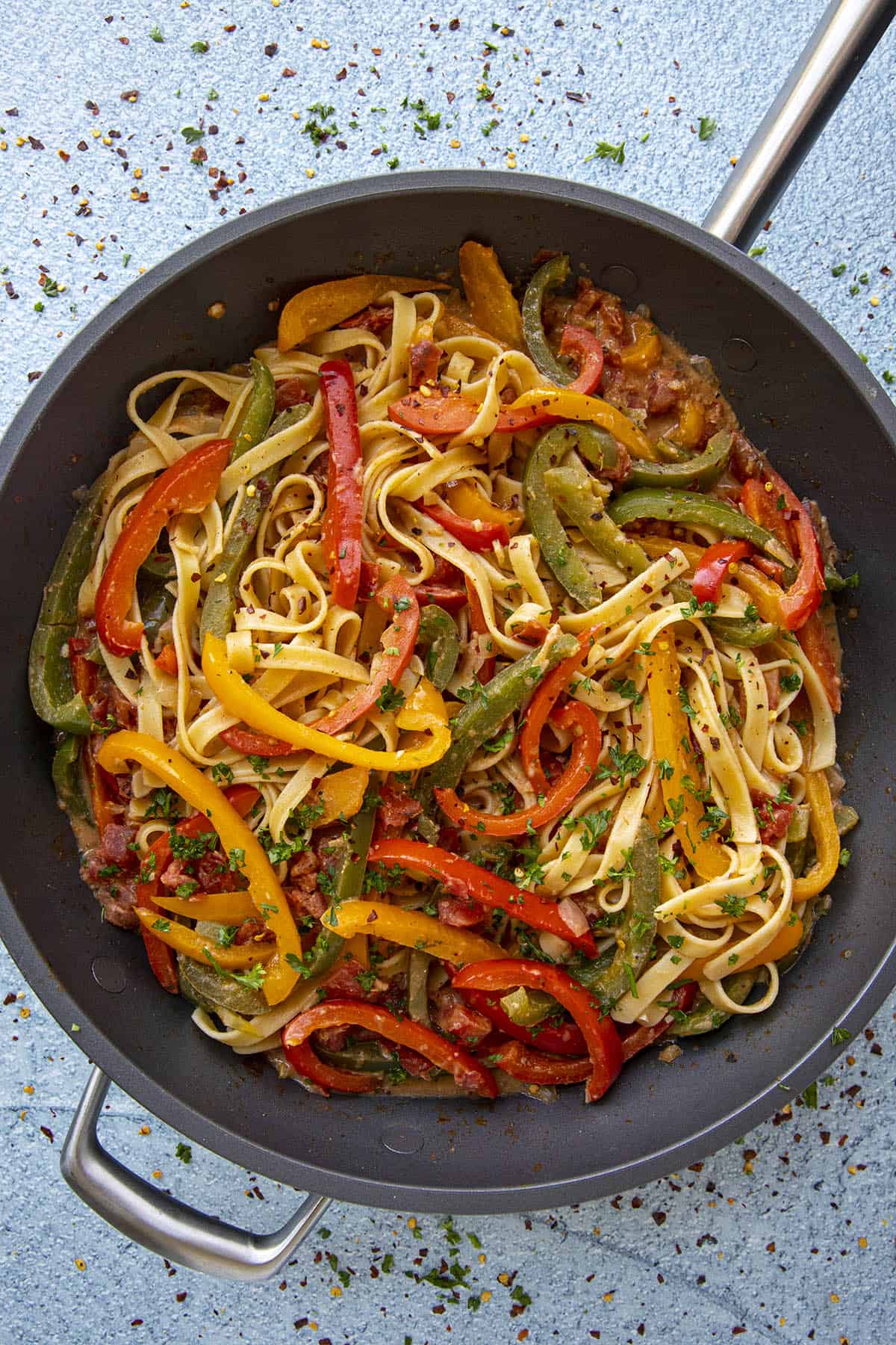 Colorful Rasta Pasta in a pan with garnish