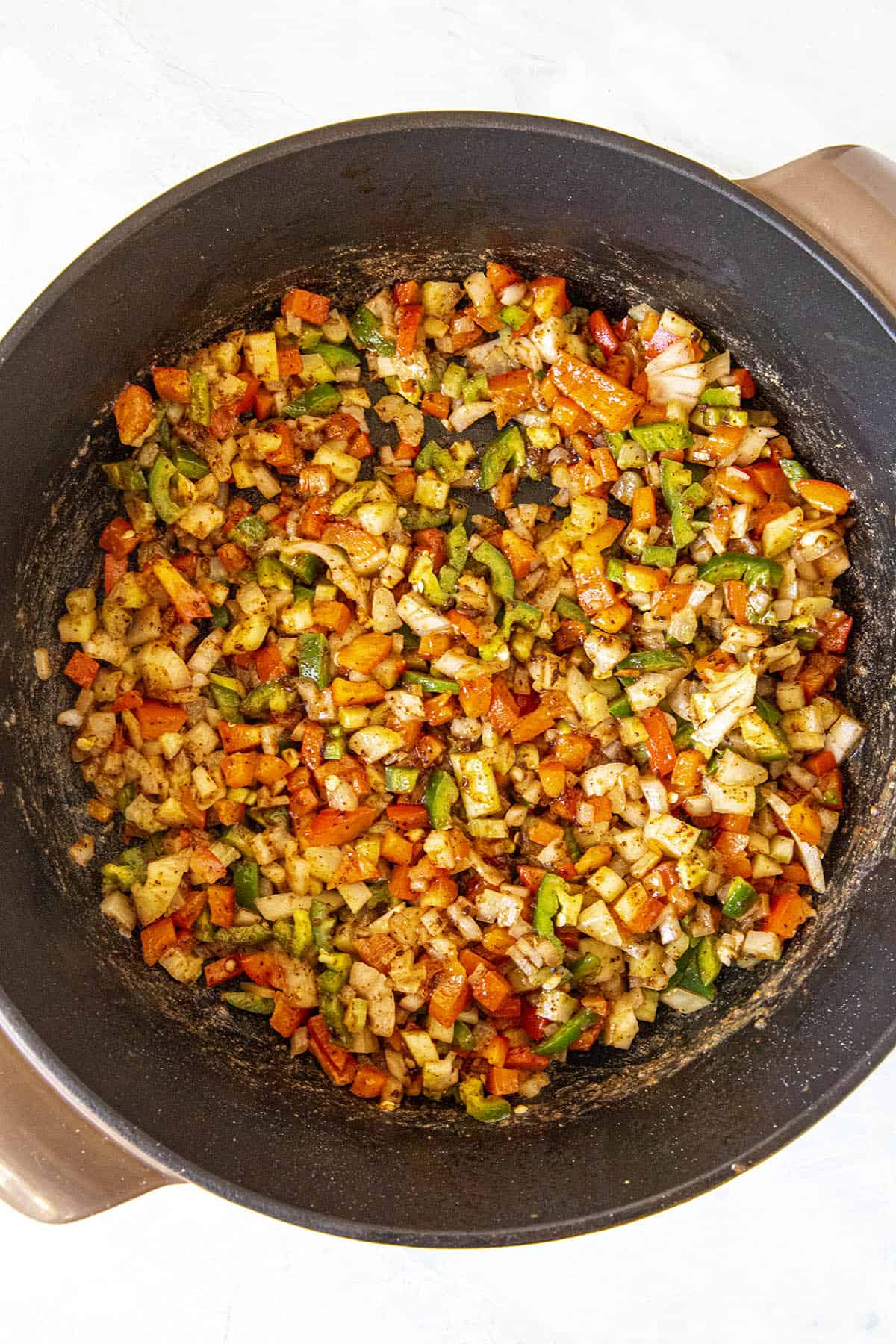 Cooking the vegetables to make Shrimp and Grits