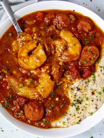 Mike taking a spoonful of Shrimp and Grits