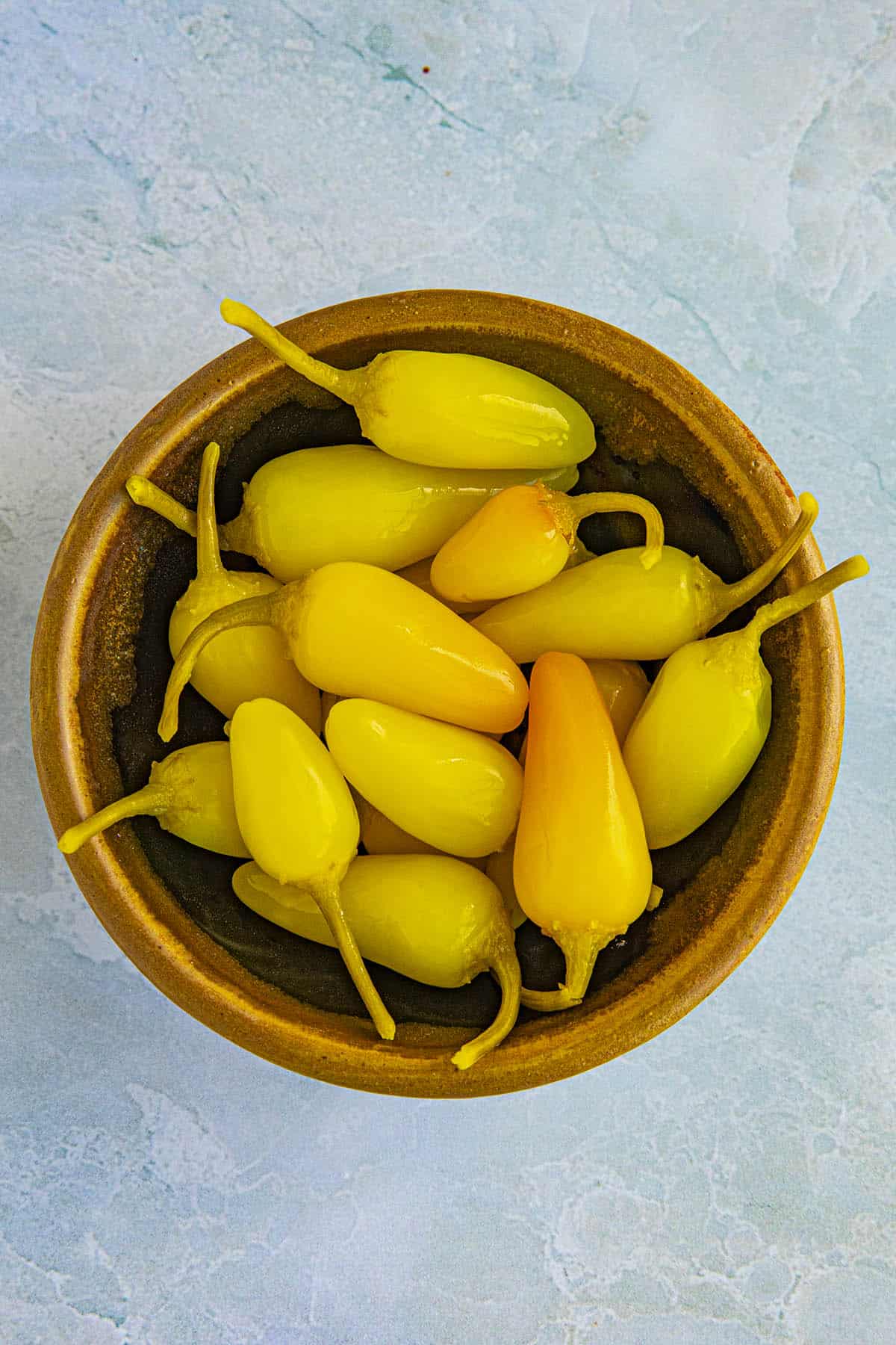 A bowl full of pickled Cascabella Peppers