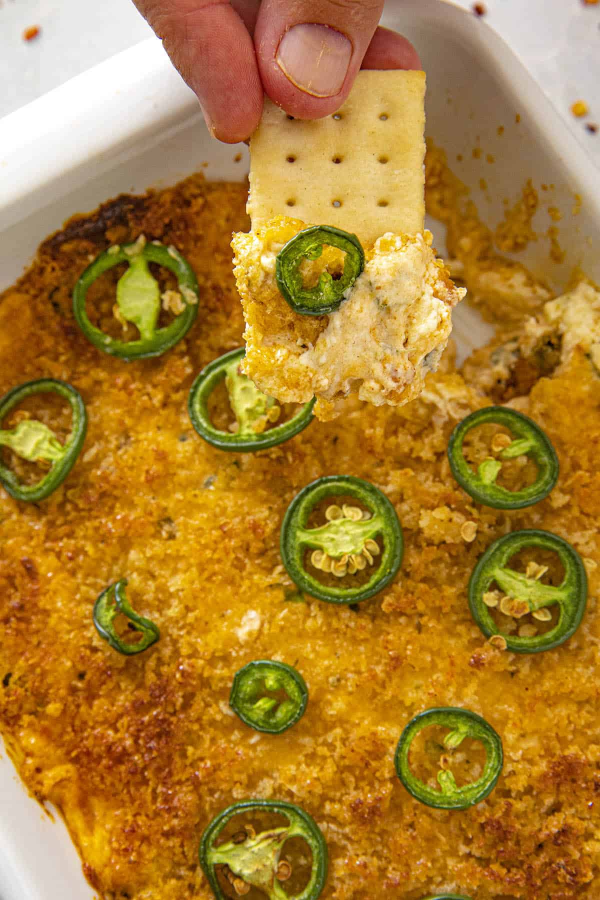 A scoop of Jalapeno Popper Dip on a cracker