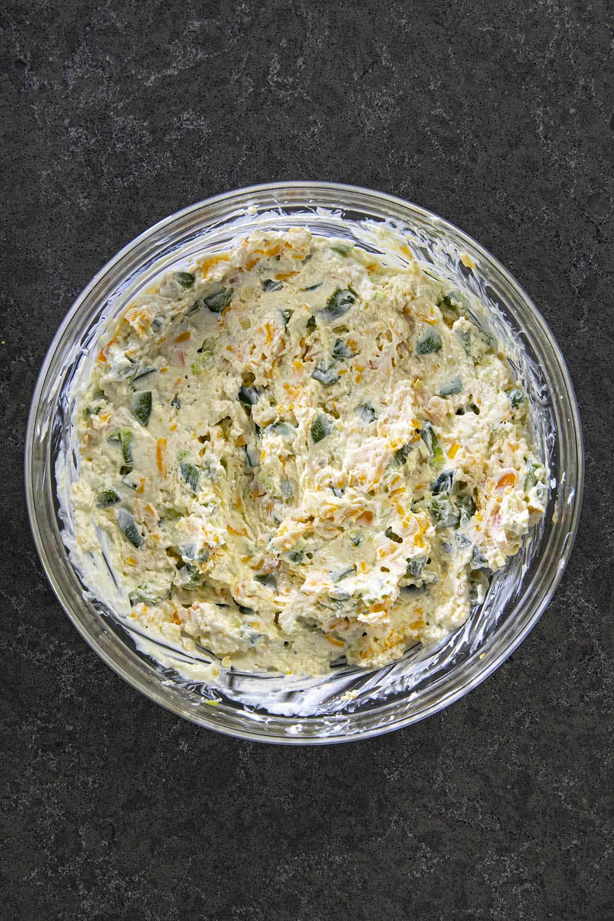 Mixing Jalapeno Popper Dip in a bowl