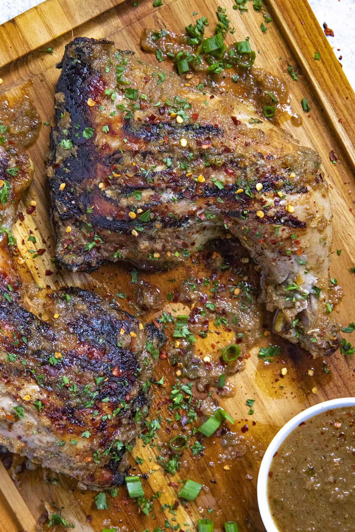 A piece of Jerk Chicken on a serving platter