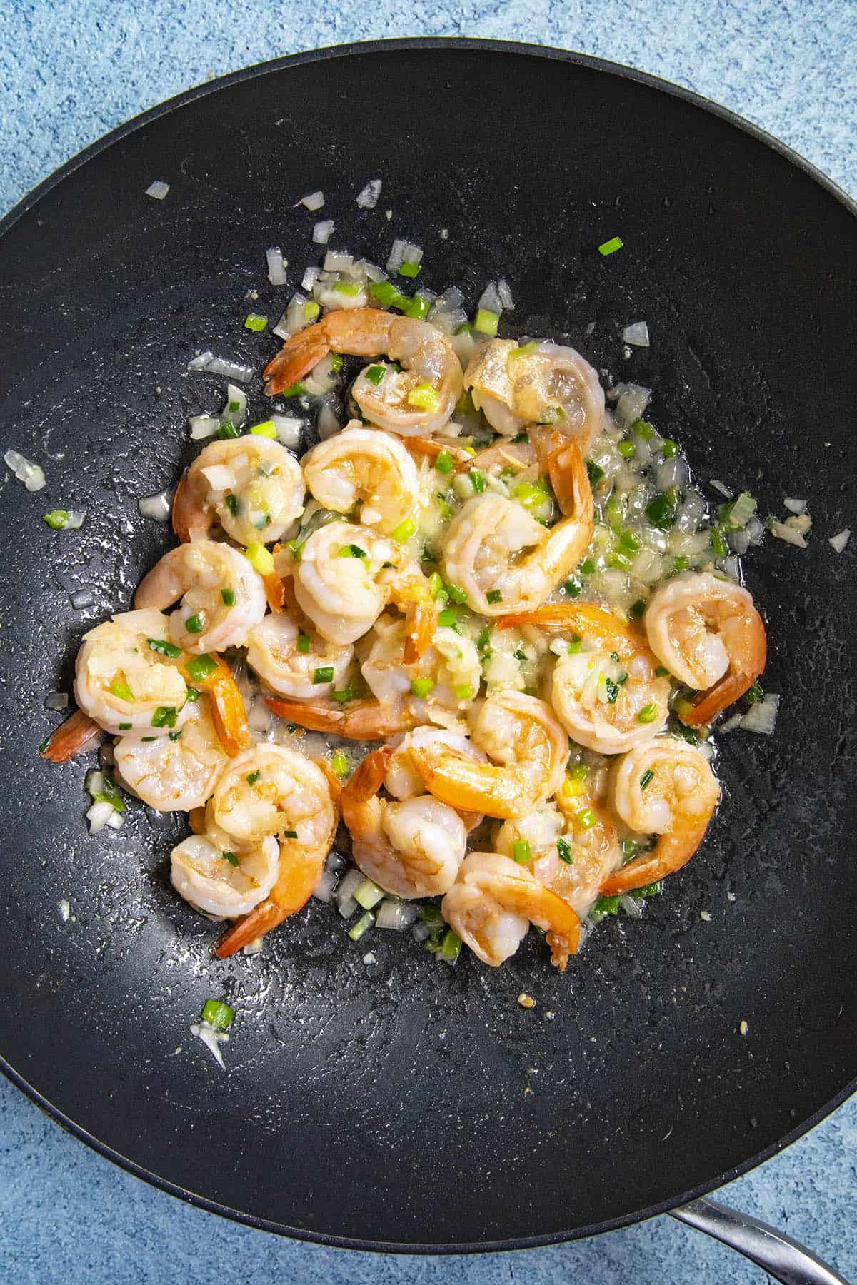 Stirring the shrimp into the Mie Goreng