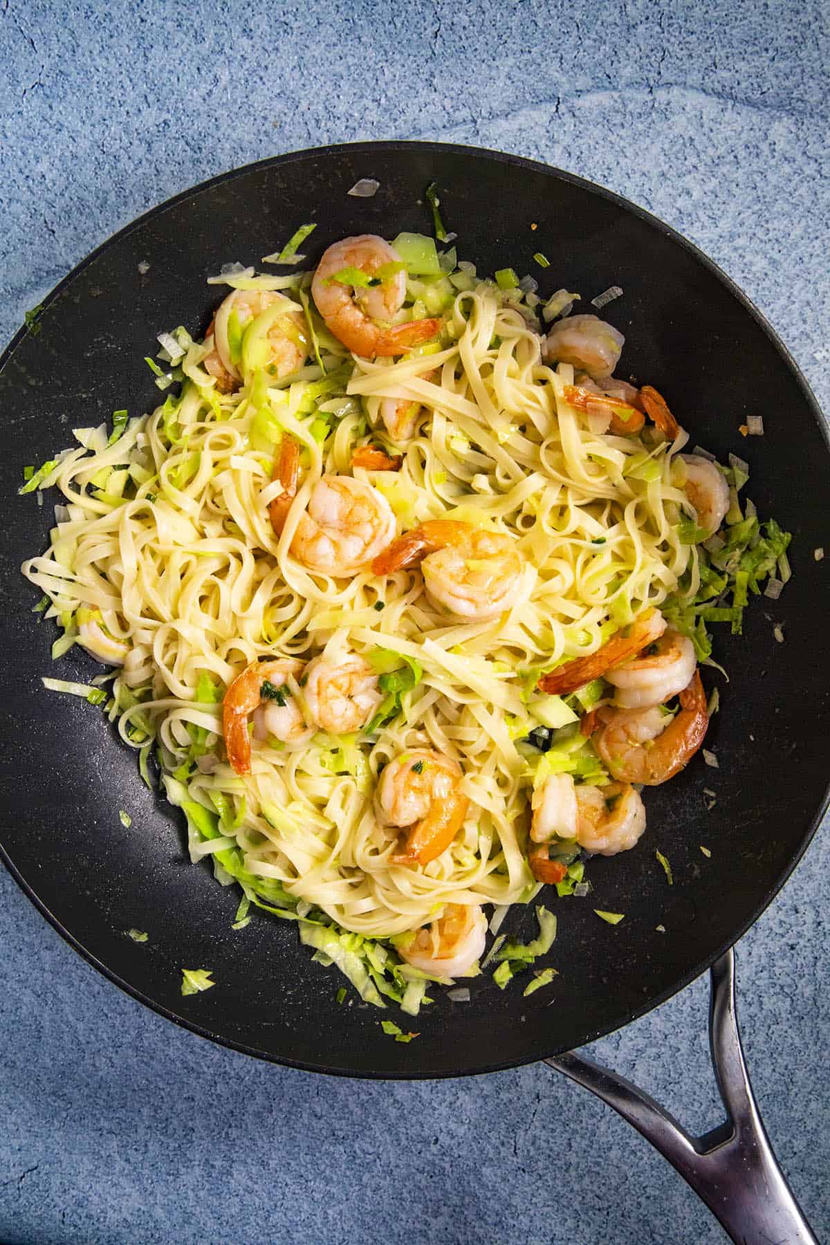 Stirring the noodles into the Mie Goreng