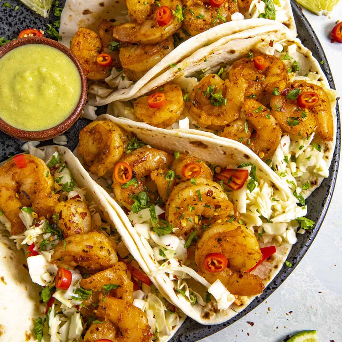 Shrimp Tacos Recipe (with Creamy Jalapeno Sauce and Crunchy Slaw)