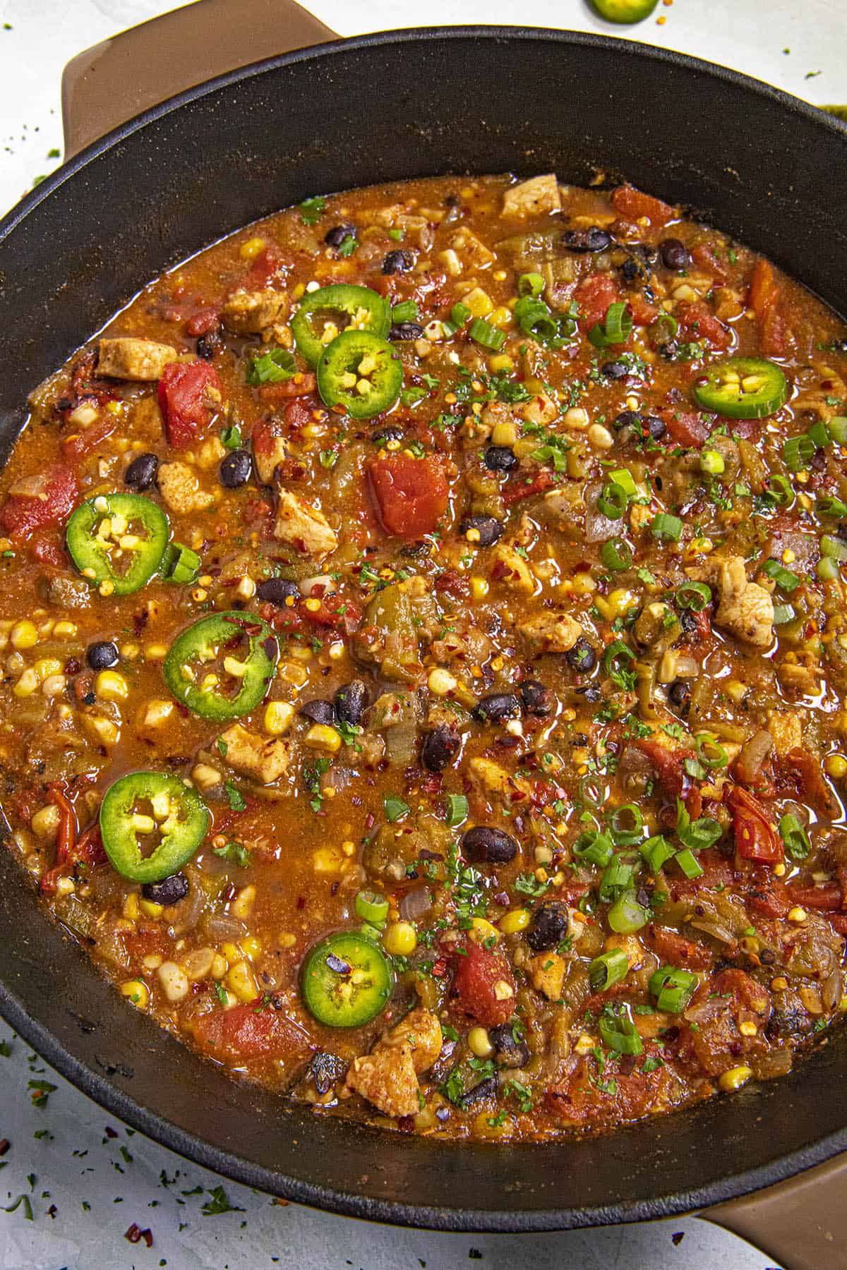 Southwest-style Chicken Soup in a pot with garnish