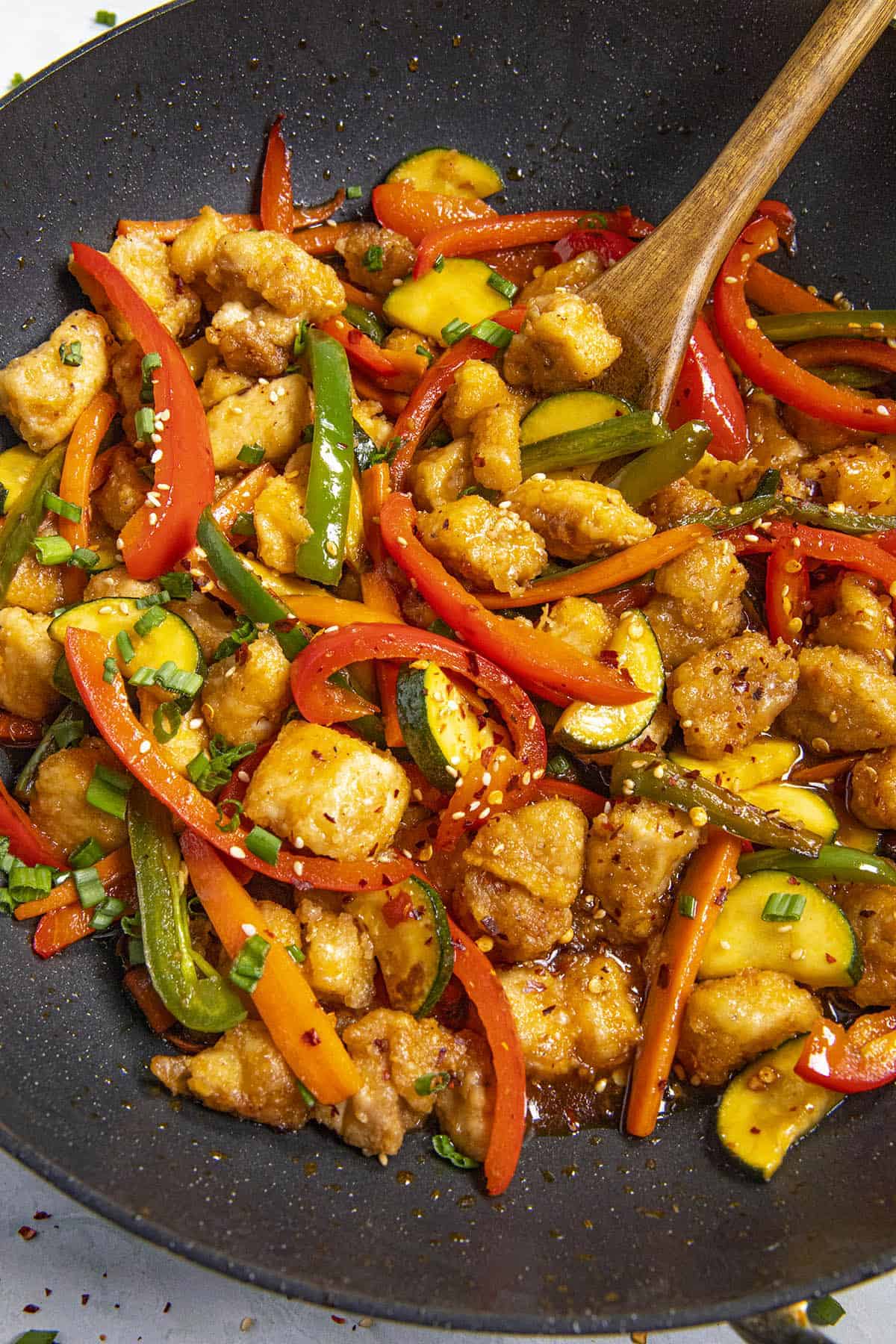 Mike stirring Hunan Chicken in a hot wok