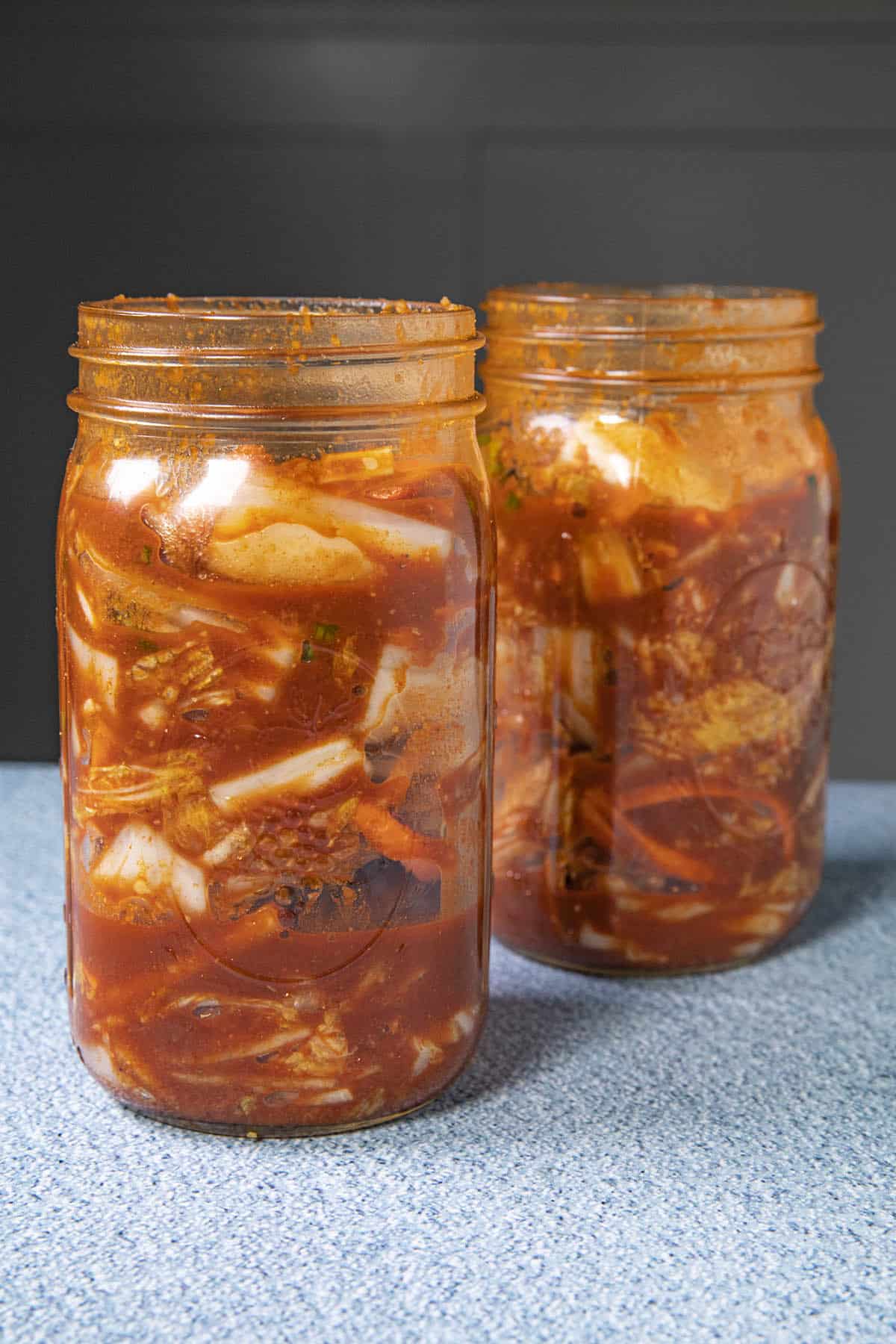 Stuff the kimchi into jars to ferment