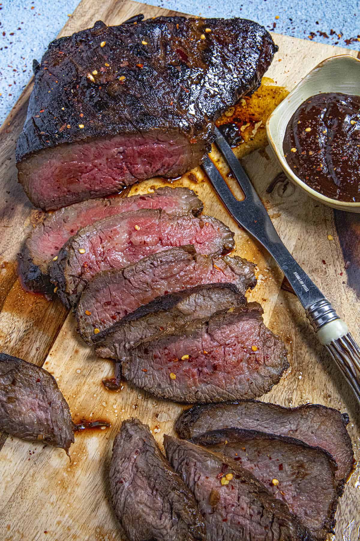 Slices of marinated, oven roasted tri tip ready to serve