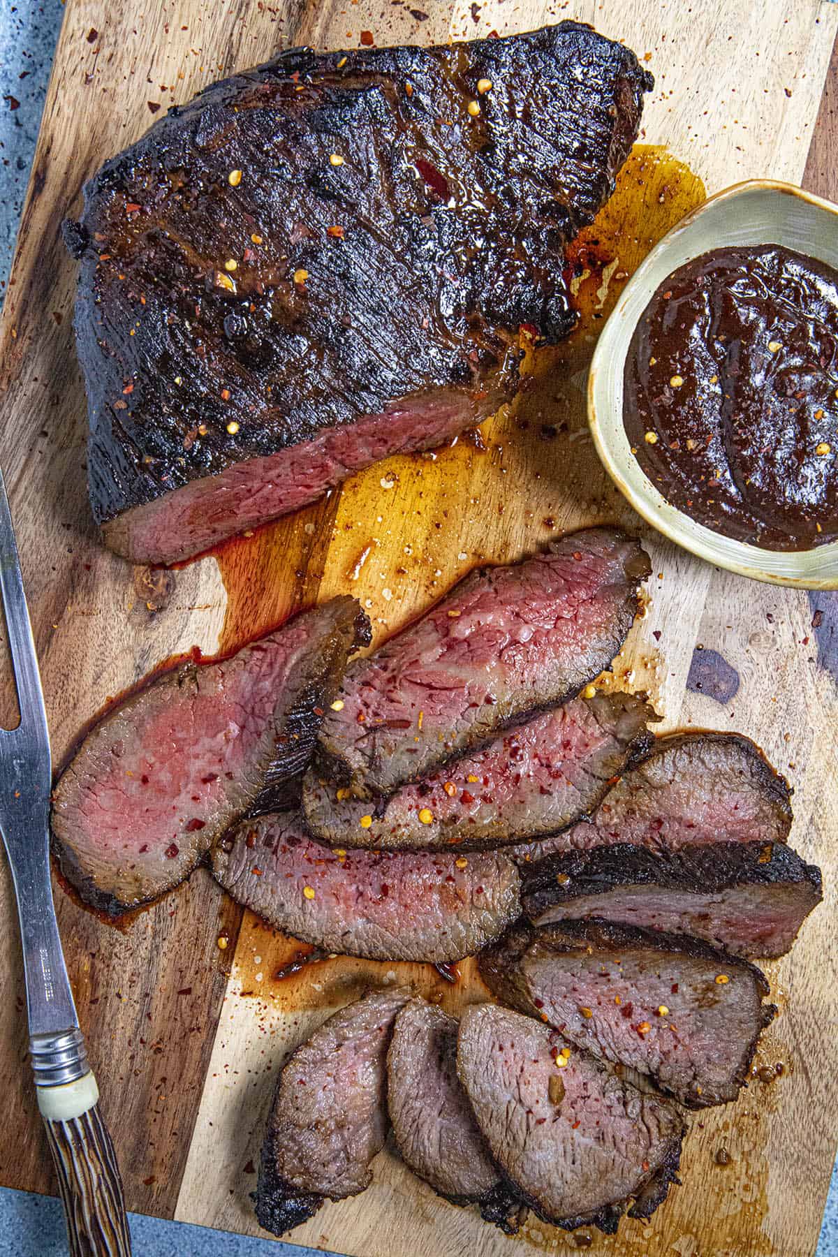 Sliced tri tip steaks on a cutting board