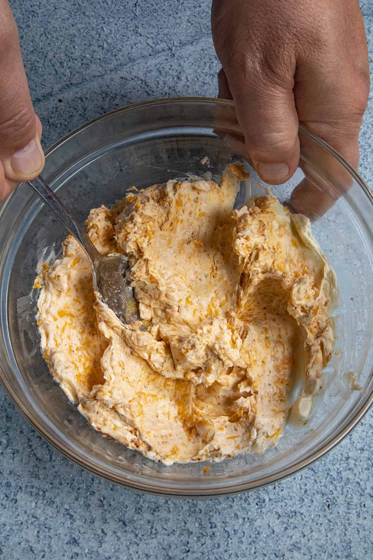 Mixing cheese stuffing to make air fryer jalapeno poppers