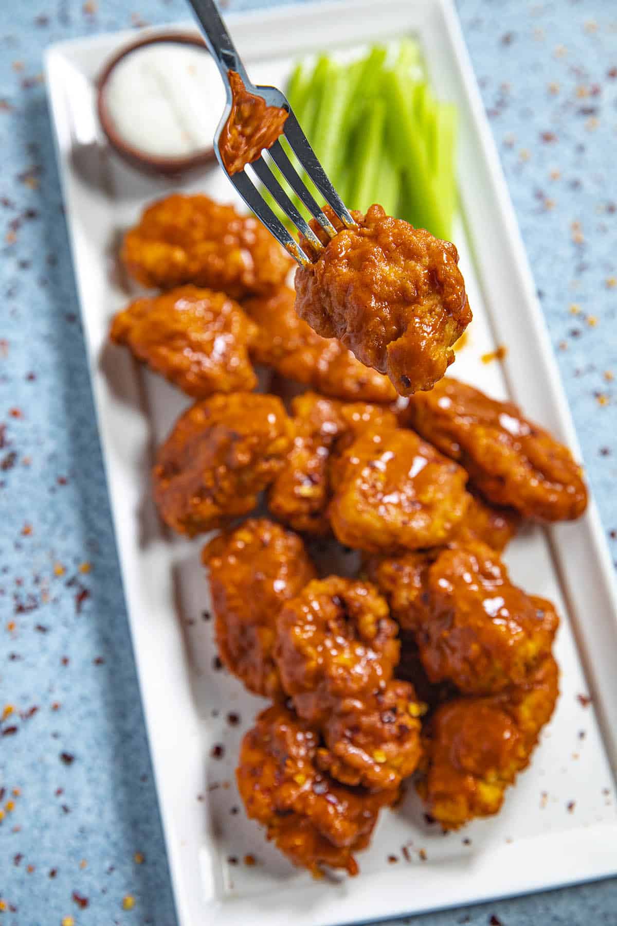 Mike taking a Boneless Buffalo Wing from the platter