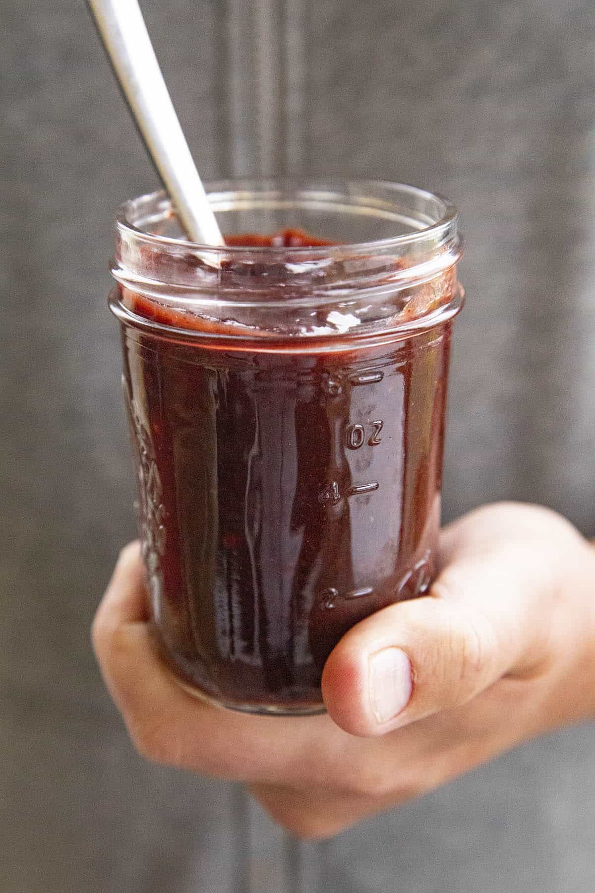 Mike holding a jar of Chamoy Sauce