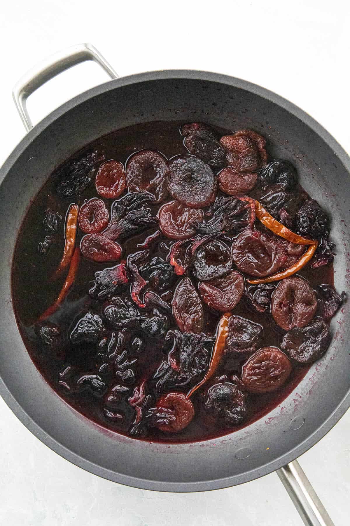 Simmering ingredients in a pan to make chamoy sauce