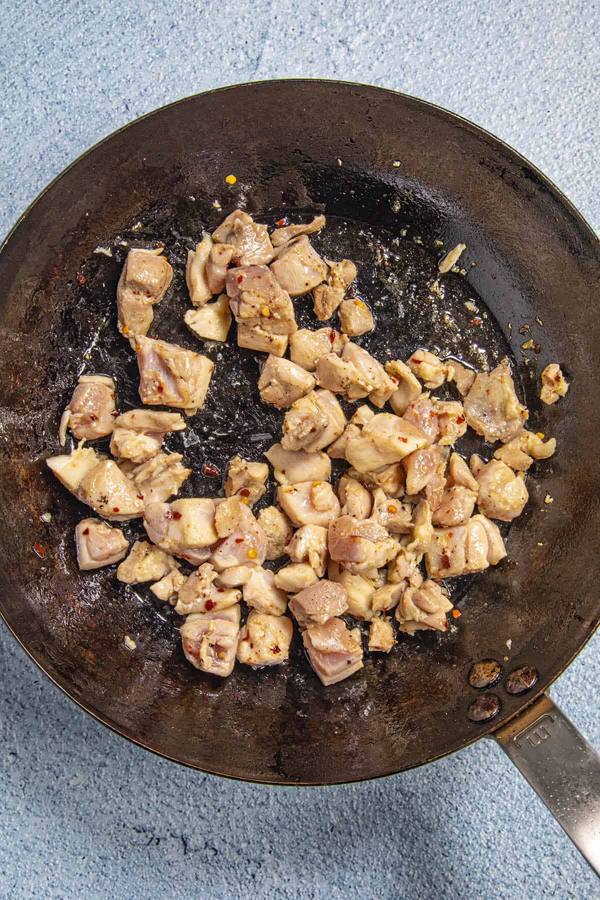 Cooking chicken pepper in a pan