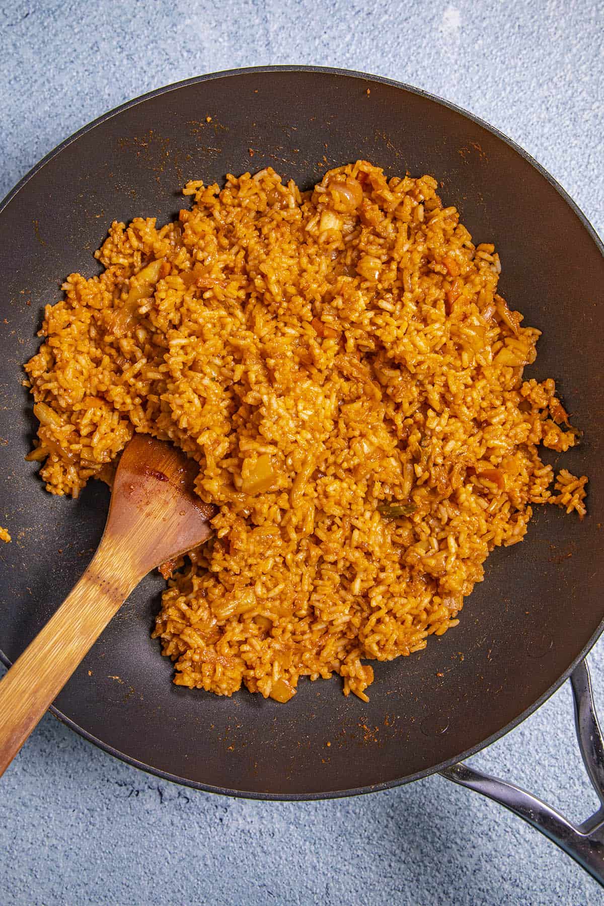 Stirring kimchi fried rice in a hot pan