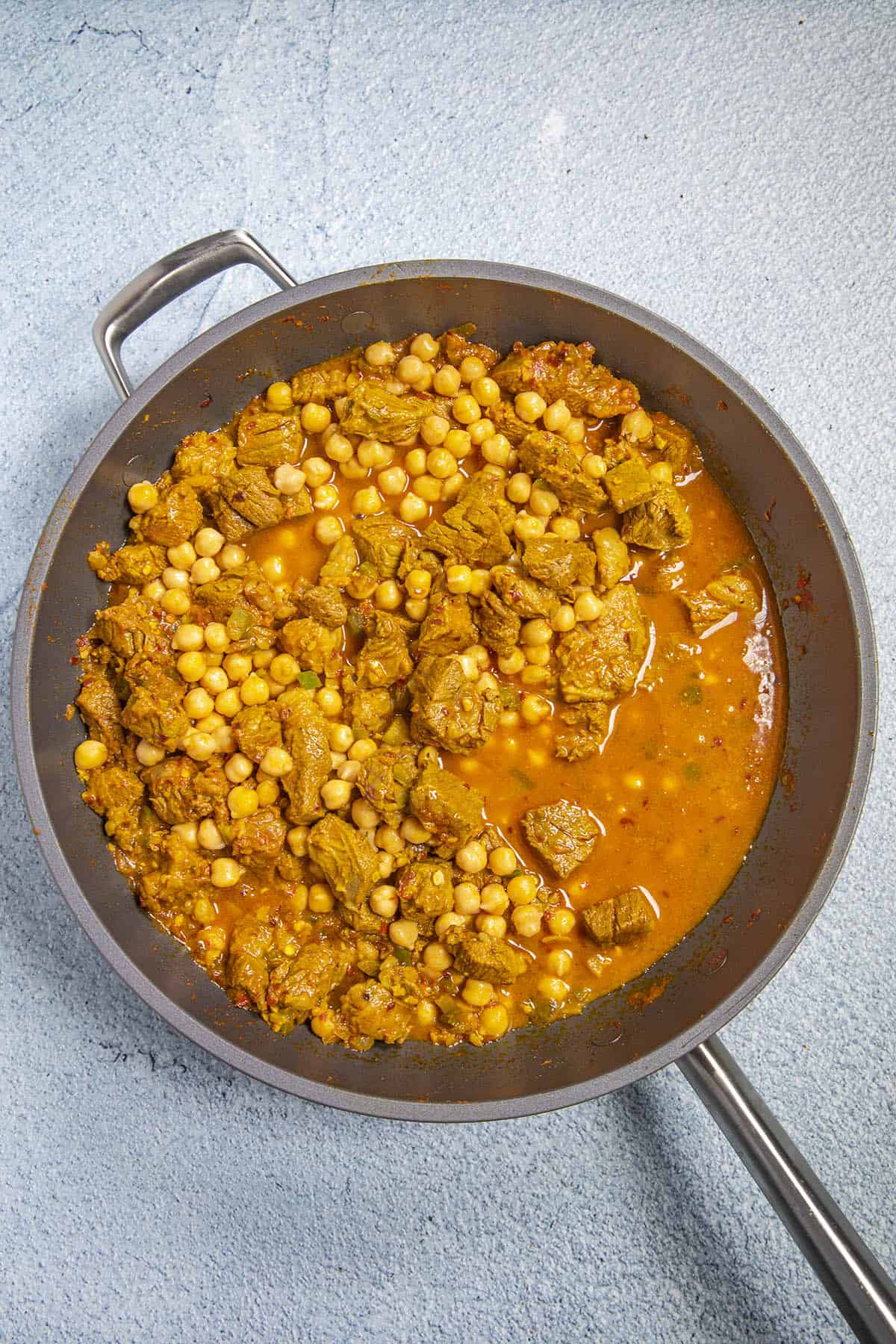 Added chickpeas and water to the pan to make Lamb Vindaloo