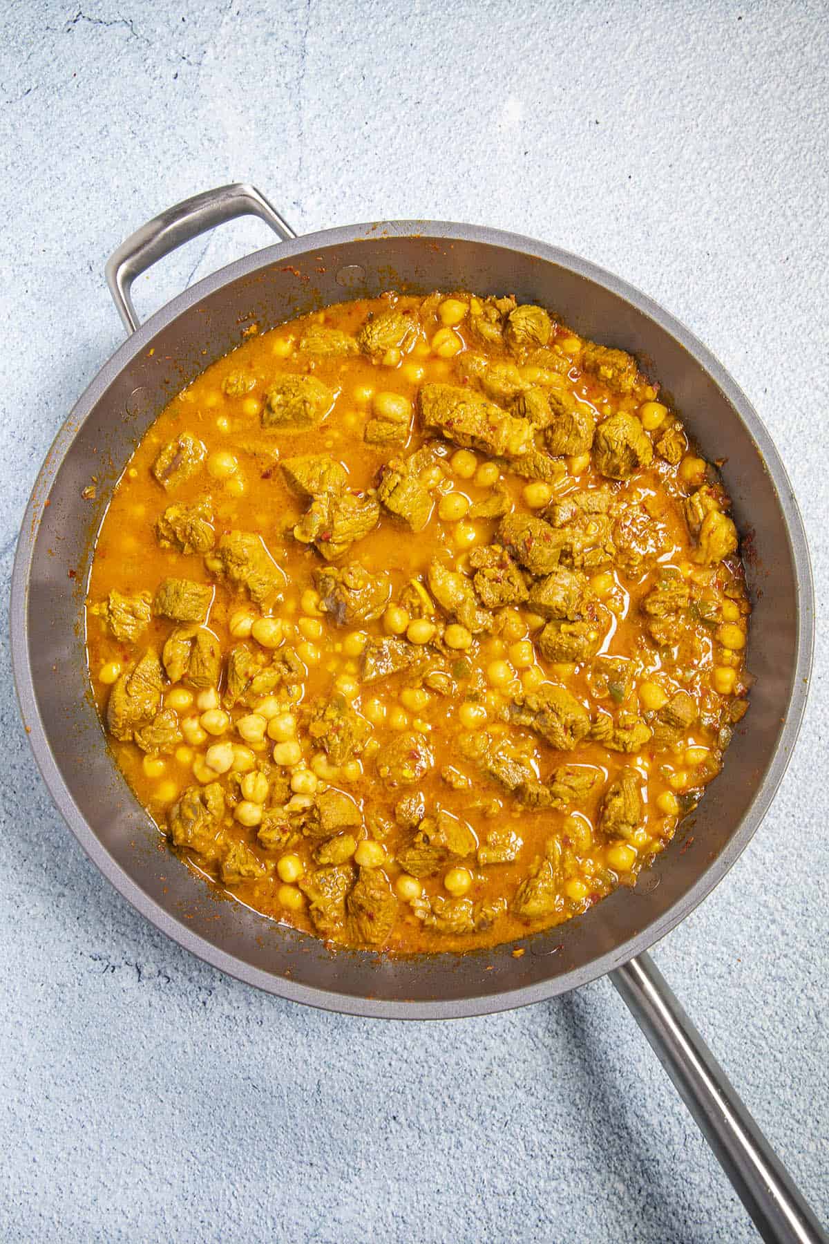 Simmering Lamb Vindaloo in a pan