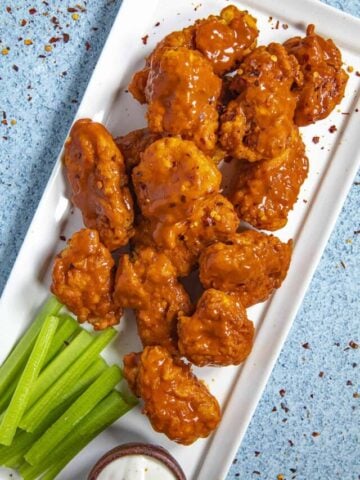 Saucy Boneless Buffalo Wings on a platter ready to serve