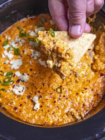 Mike taking a scoop of Crockpot Buffalo Chicken Dip