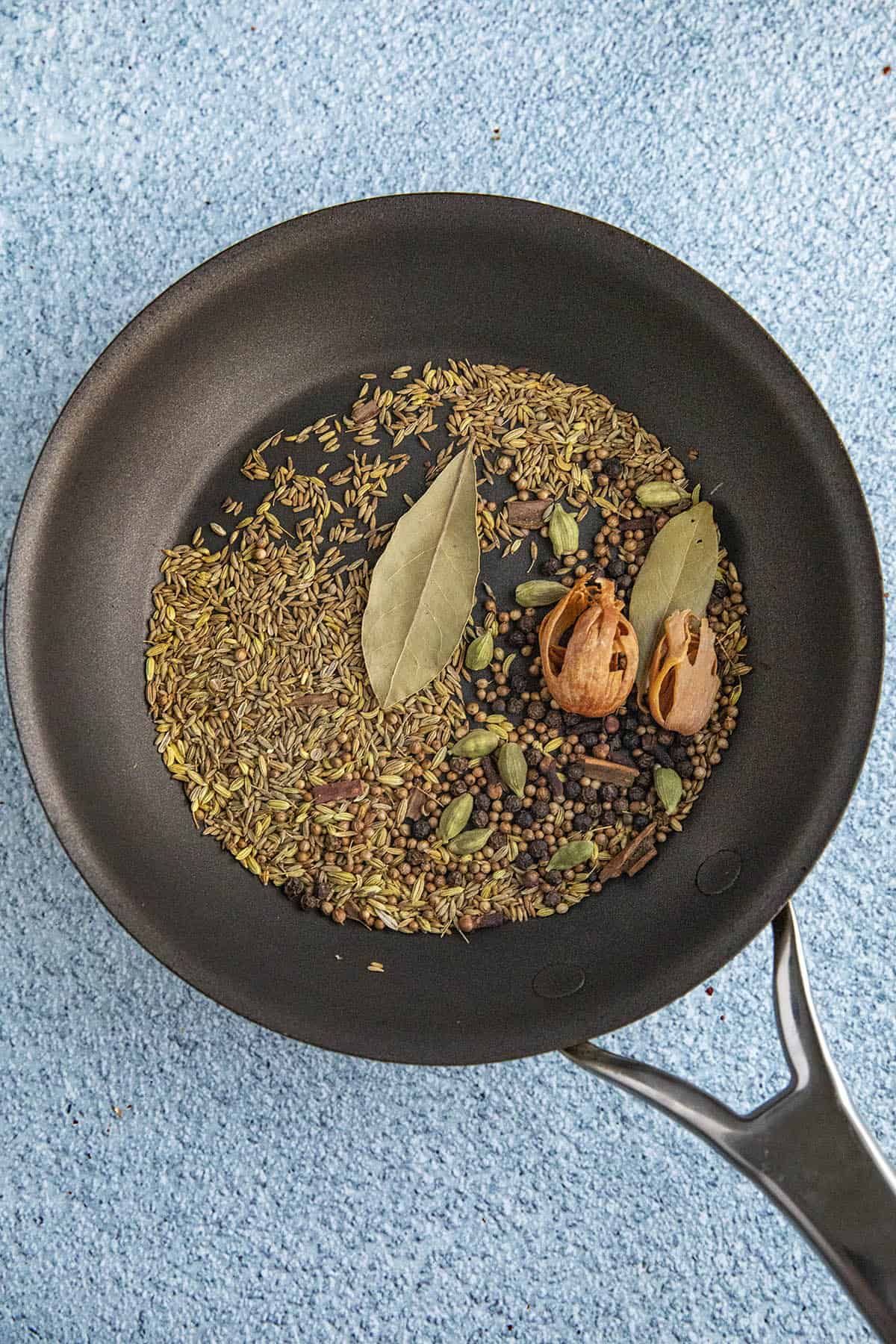 Toasting seeds and spices in a hot pan to make Garam Masala