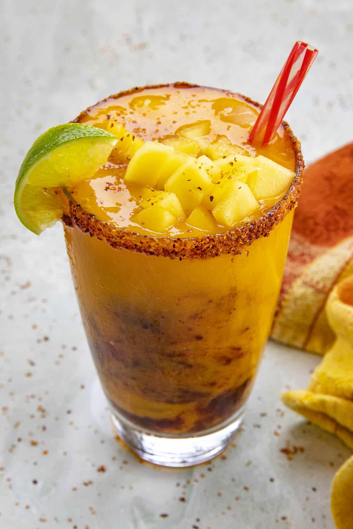 A Mangonada with lots of chopped mango on top
