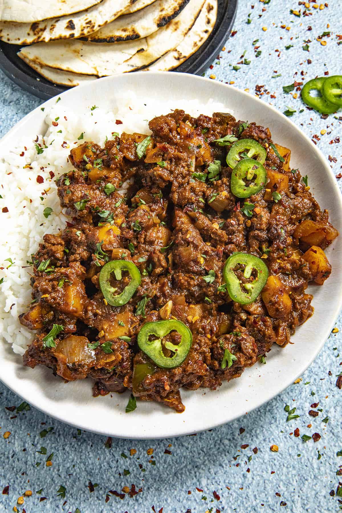 Mexican Picadillo with Ancho Peppers on a plate with rice