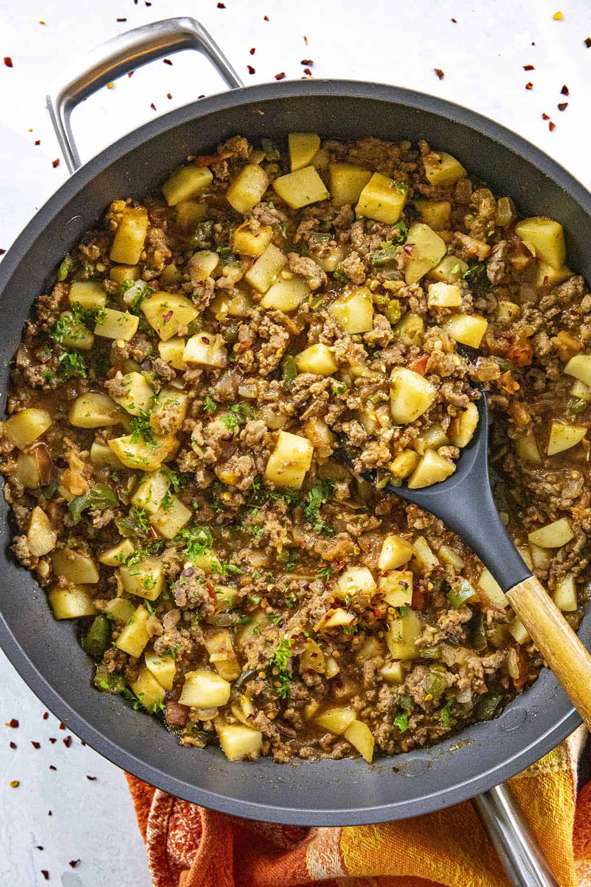 Scooping Mexican Picadillo from the hot pan