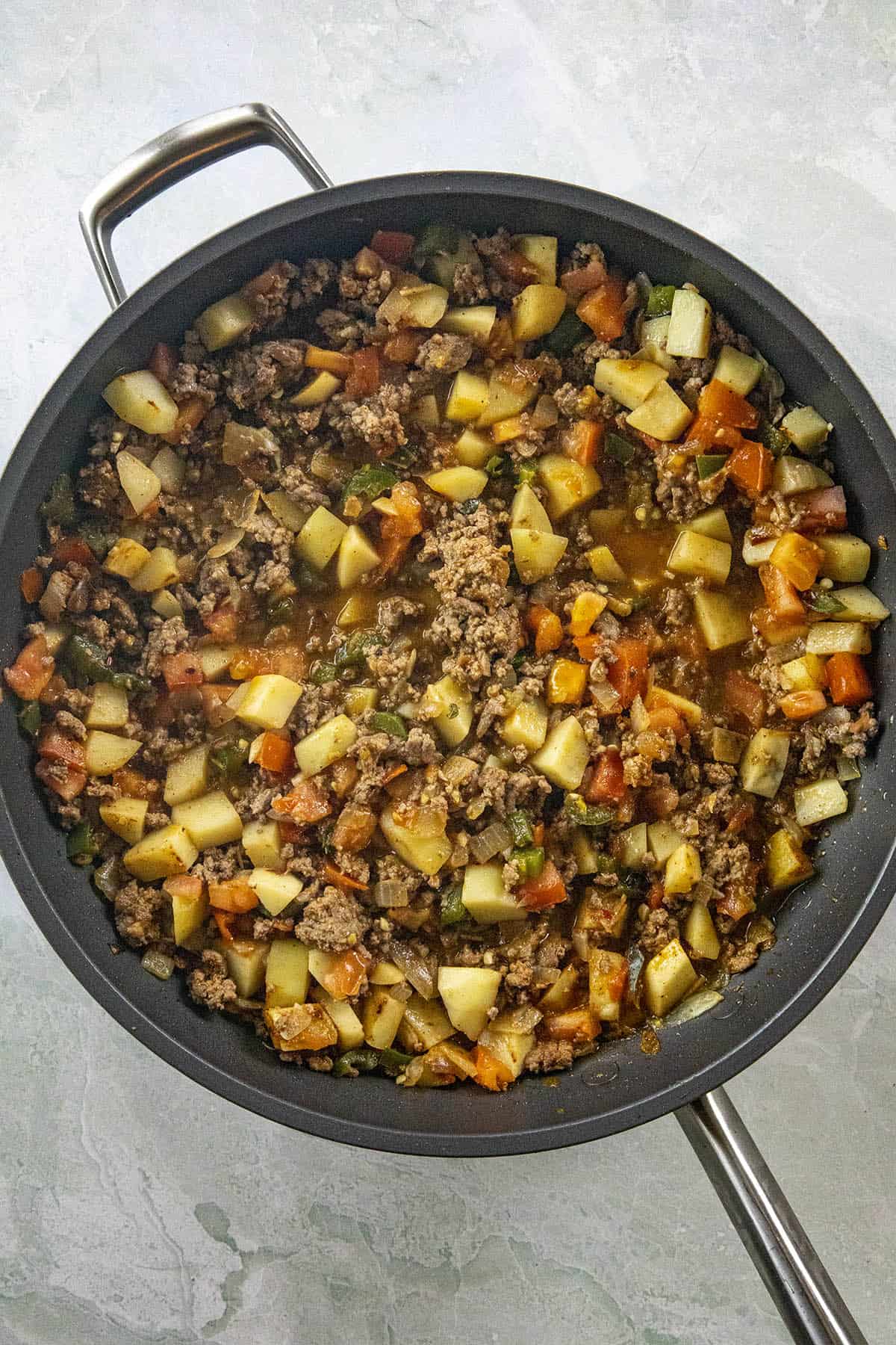 Mexican Picadillo simmering in a pan