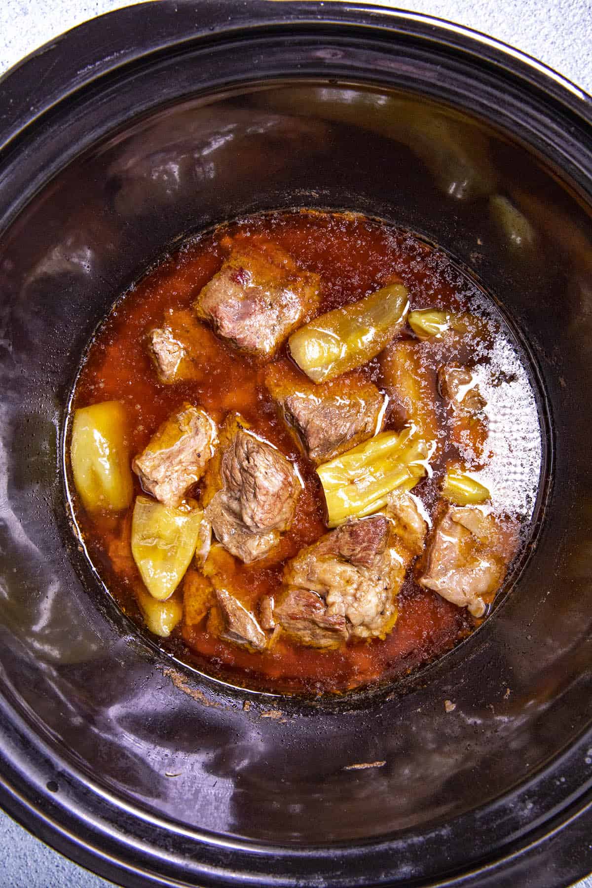 Mississippi Pot Roast simmering in a slow cooker