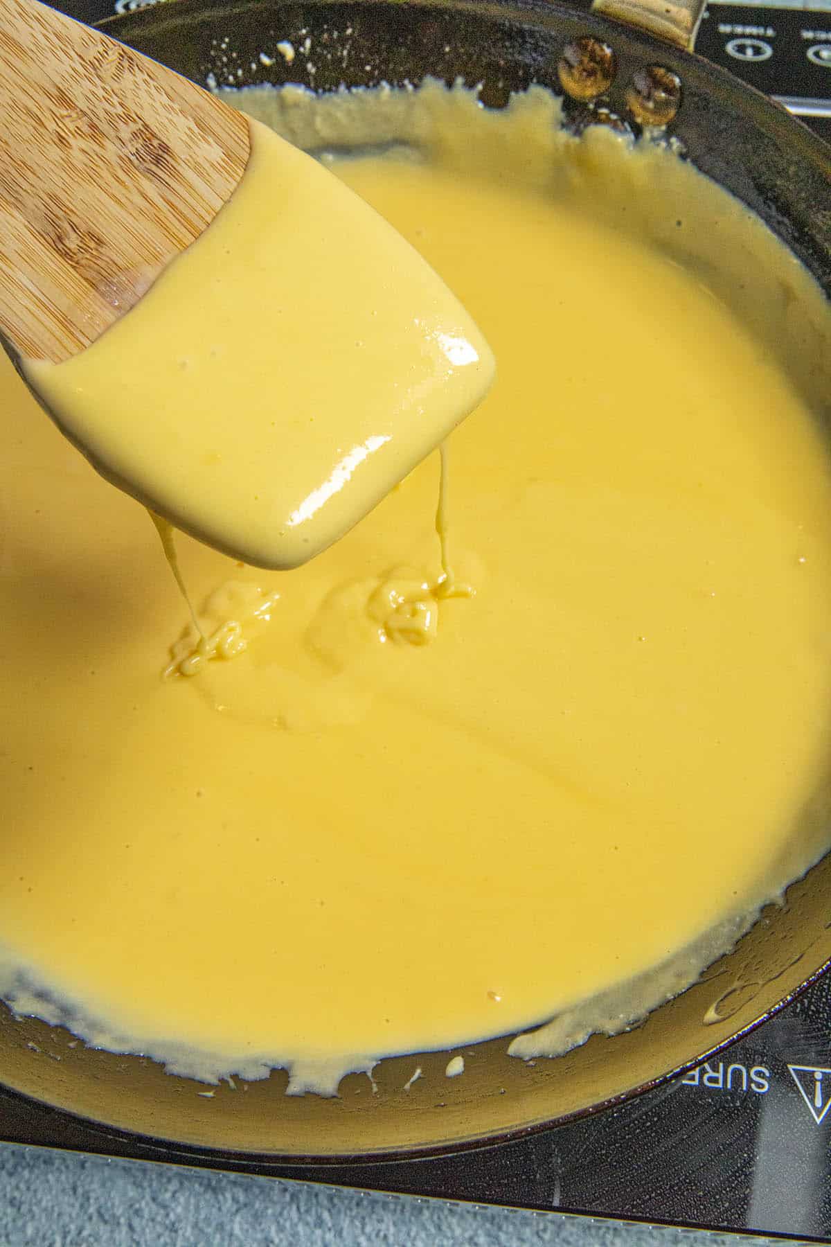 Mike stirring homemade Nacho Cheese Sauce