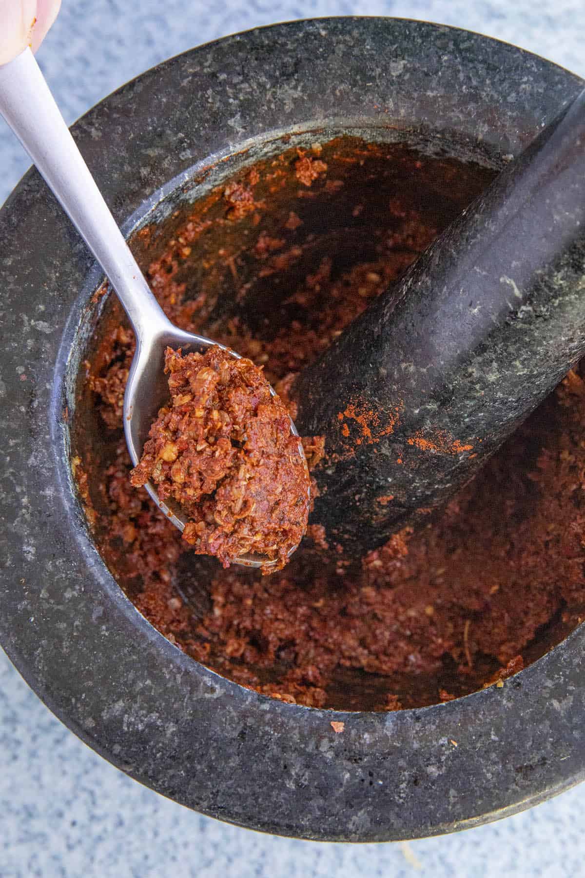 Freshly ground Achiote Paste on a spoon