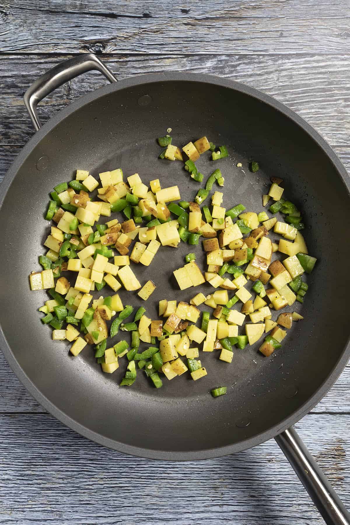 Cooking potatoes with jalapenos for spicy breakfast tacos