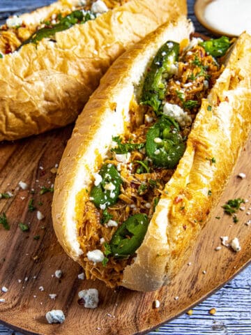 Buffalo Chicken Sandwiches with blue cheese crumbles and roasted jalapenos