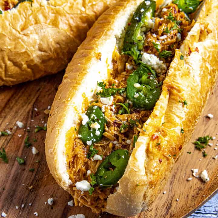 Buffalo Chicken Sandwiches with blue cheese crumbles and roasted jalapenos