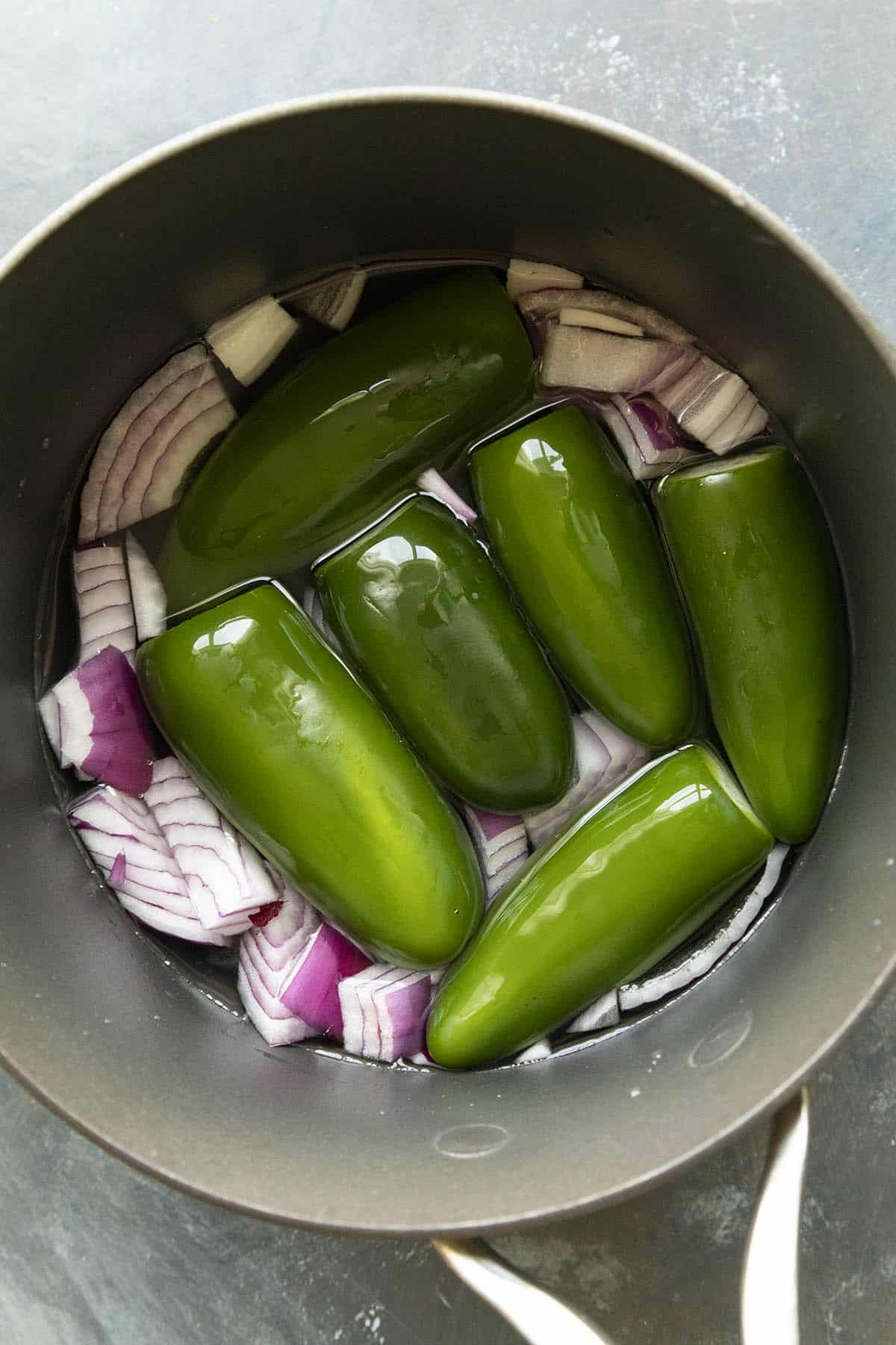 Boiling the ingredients to make Creamy Jalapeno Sauce