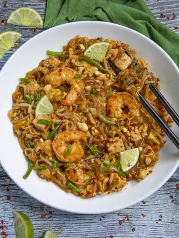 Pad Thai in a bowl with chopsticks