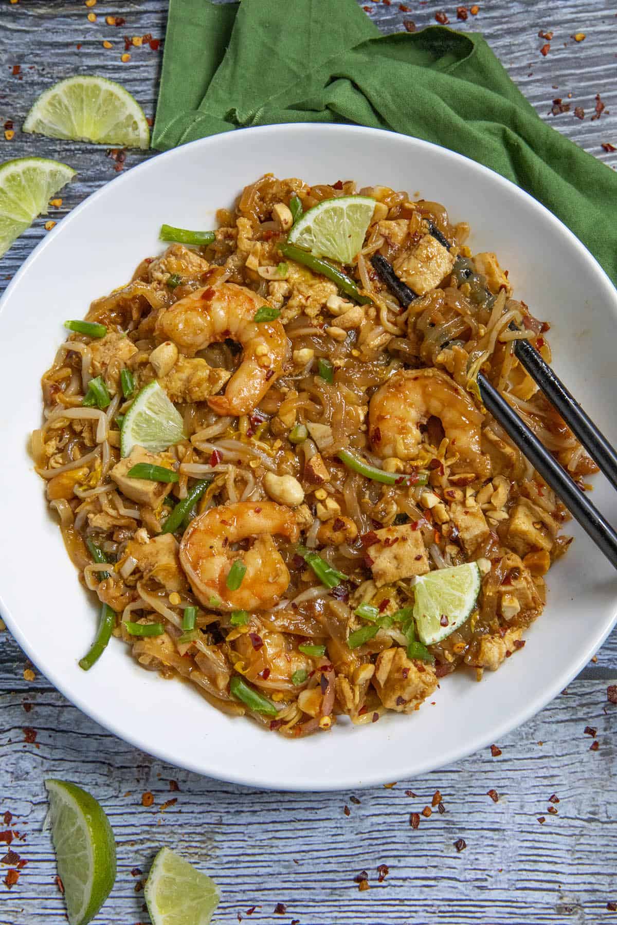 Pad Thai in a bowl with chopsticks