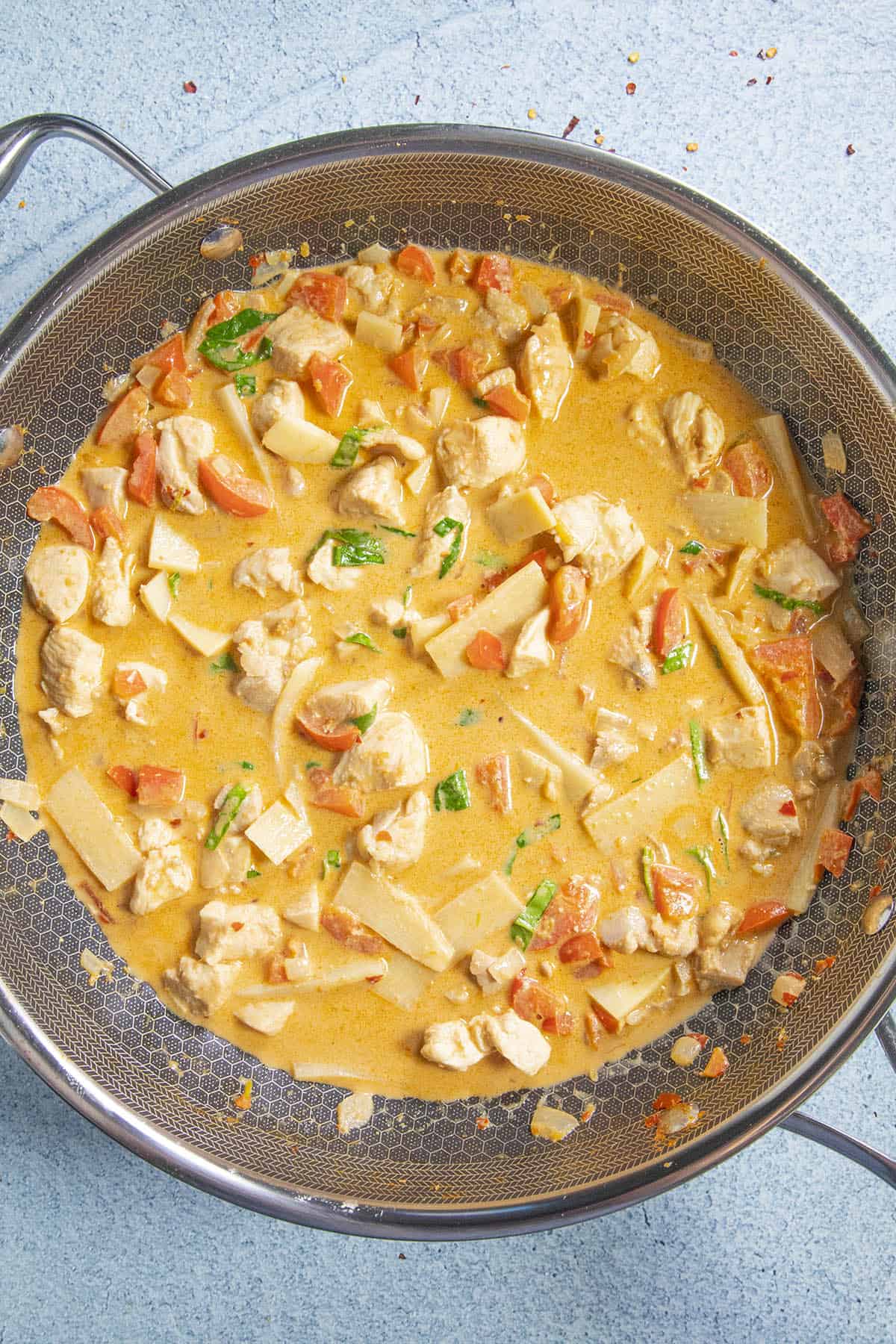 Coconut milk added to the pan of Panang Curry